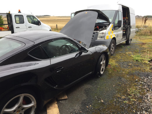 Close-view inspection of an engine's timing belt.